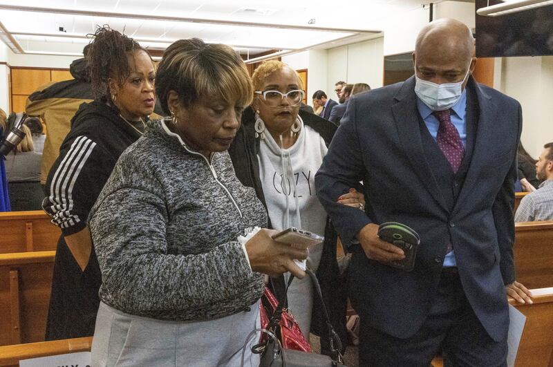 Manny Ellis’s mother, Marcia Carter-Patterson, second from right, is escorted out of court after the jury’s verdict was delivered (Ellen M. Banner/The Seattle Times via AP, Pool)