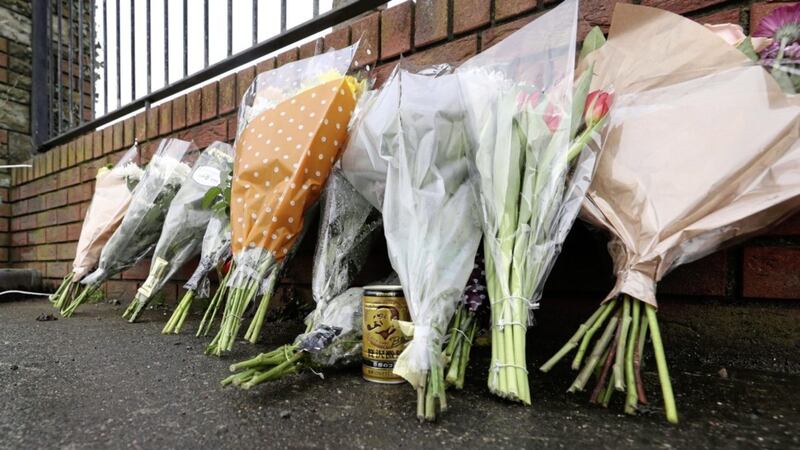 tributeS: Flowers and a can of Japanese coffee on Avenue Road in Dundalk, Co Louth, close to the scene where Yosuke Sasaki was stabbed to death 				Picture: Niall Carson/PA 