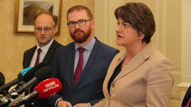 Arlene Foster with DUP colleagues Simon Hamilton and Peter Weir. Picture by Hugh Russell&nbsp;