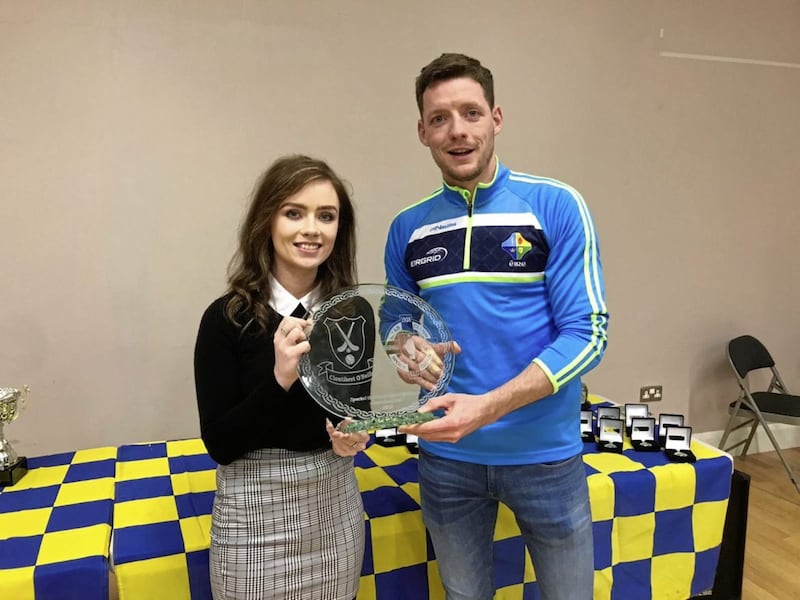 St Patrick&#39;s, Saul&#39;s Lucy Connor makes a presentation to Allstar forward Conor McManus on behalf of the club during their recent underage presentation 