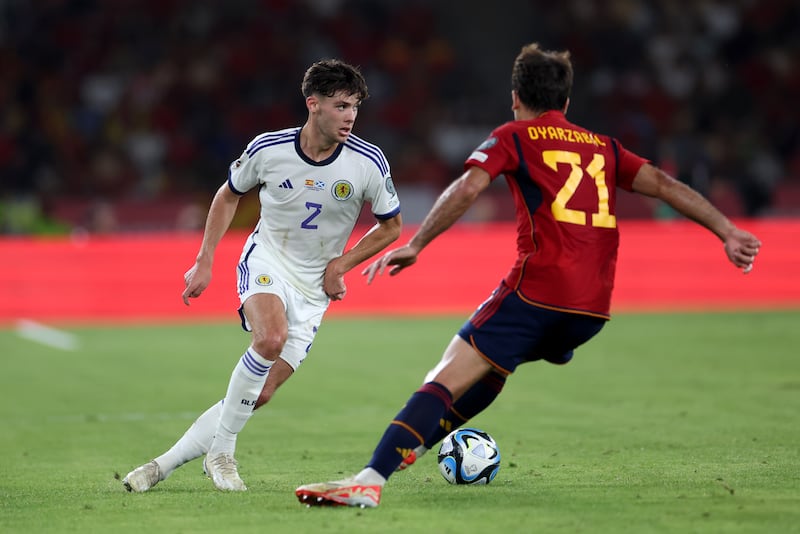 Aaron Hickey in action against Spain in October