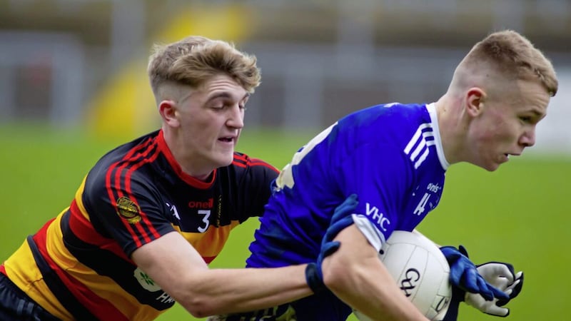 Aaron O&#39;Neill from St Colman&#39;s College holds off the Abbey&#39;s Ciaran Tiernan during in the MacRory Cup play-off at P&aacute;irc Esler on Thursday Picture: Noel Moan 