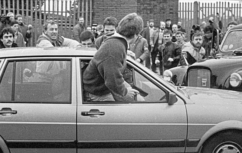 Corporals Woods and Howes trapped in their Volkswagon car as a crowd gathered around them. 