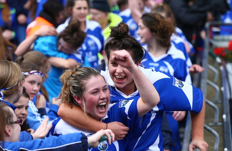 Beth Carton and Niamh Rockett celebrate Waterford's win over Kildare in the 2015 All-Ireland Intermediate Championship final at Croke Park