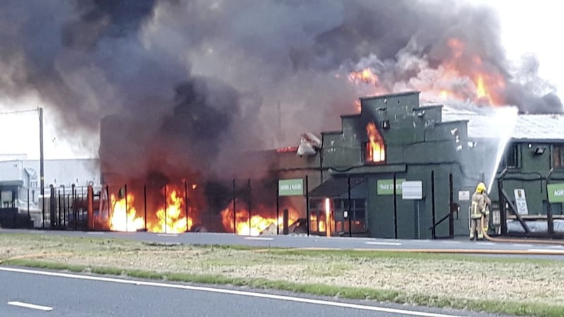 The fire at the JP Corry store outside Ballymena was well alight when firefighters arrived. Picture by Pacemaker Press 