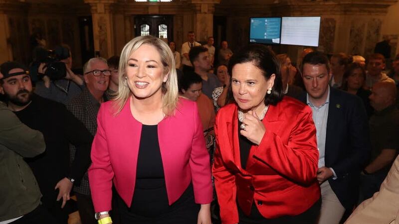 Sinn Féin’s Michelle O’Neill, left, and Mary Lou McDonald arrive at Belfast City Hall as results continue to come in for the Northern Ireland local elections (Liam McBurney/PA)