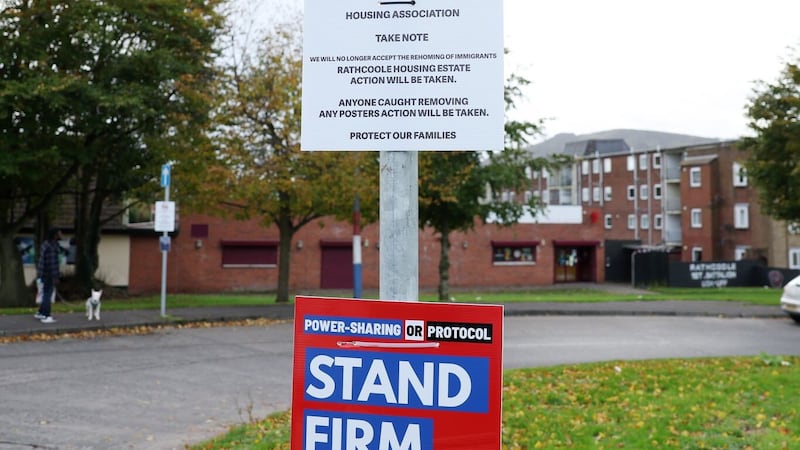 Posters warning against 'illegal immigrants' being housed in Rathcoole have appeared in the estate 