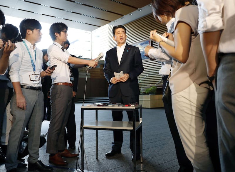 Shinzo Abe speaks to the press (AP)