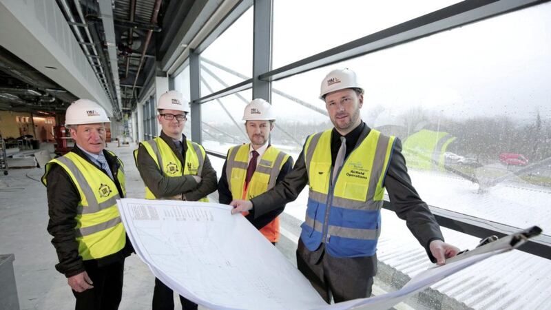 Pictured at Belfast City Airport are Michael Carroll (project manager) and William Sproule (fit-out director) from H&amp;J Martin Fit Out and the airport&#39;s capital projects and engineering manager Chris Horner and capital projects engineer Jonny Rice 