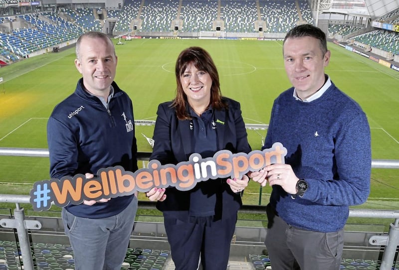 Oisin McConville (Sporting Chance facilitator and Sport NI mental helath ambassador) pictured with Steven Mills (club development officer with the Northern Ireland Football League) and Sport NI chief executive Antoinette McKeown. They were at Windsor Park to announce a new partnership between Sport NI, the NIFL and Sporting Chance 