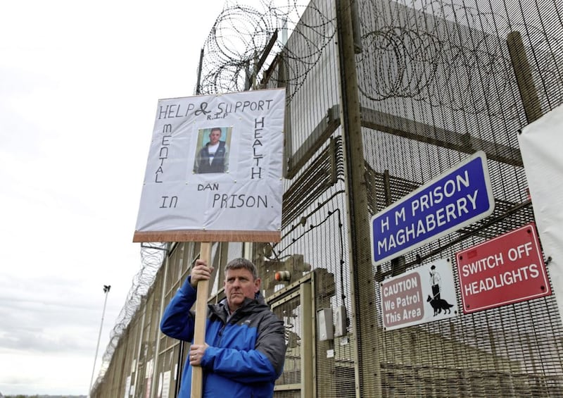 Paul McConville holding a placard during the protest outside HMP Maghaberry on Sunday. Picture by Ann McManus 
