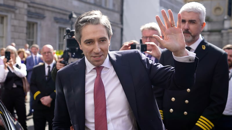 Newly elected Taoiseach Simon Harris waves to the crowd as he leaves the Dail in Dublin