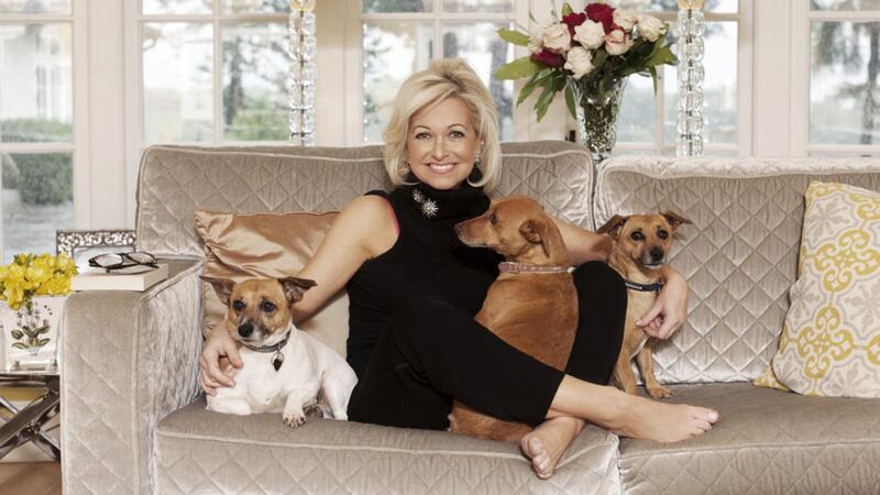 Bestselling Irish novelist, Cathy Kelly, relaxing at home with her dogs 