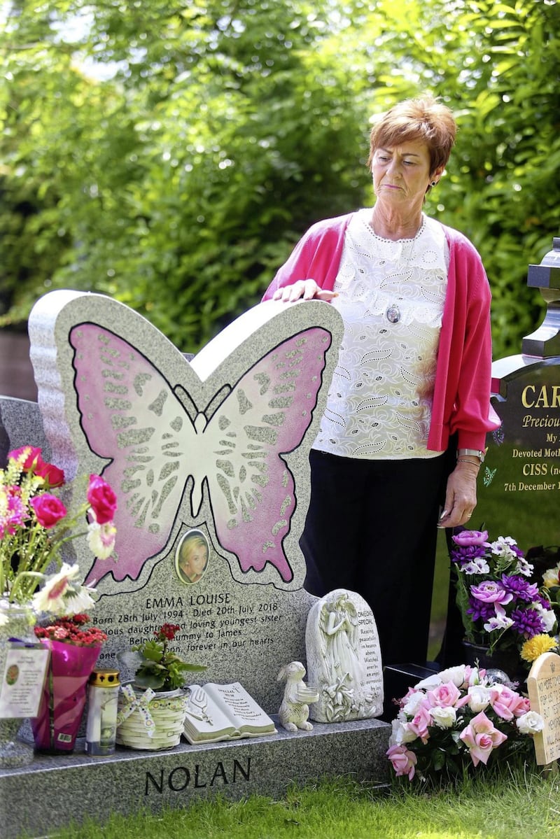 Loretta Nolan beside her daughter Emma&#39;s grave in Hannahstown Cemetery Picture Mal McCann. 