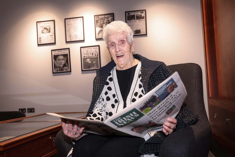 Irish News reader Catherine 'Kitty' Harriott (neé McMahon) (99) pictured reading the new-look Irish News. Picture Mal McCann