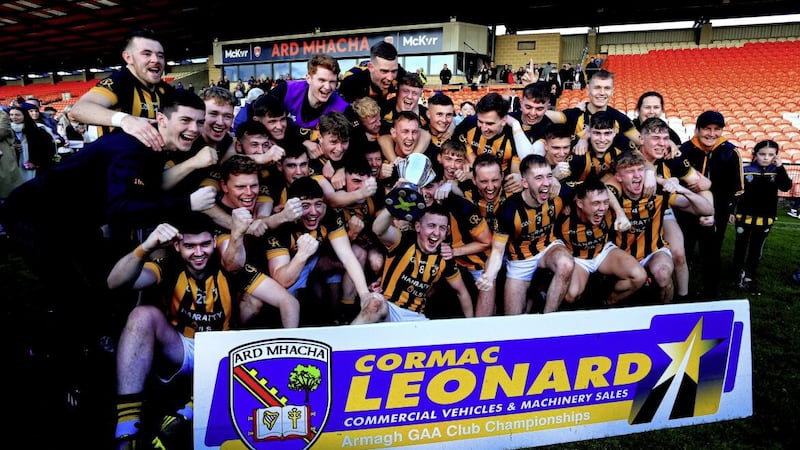 Power Rangers. Crossmaglen celebrate their club&#39;s 46th Armagh title at the Athletic Grounds yesterday. Picture: Seamus Loughran 