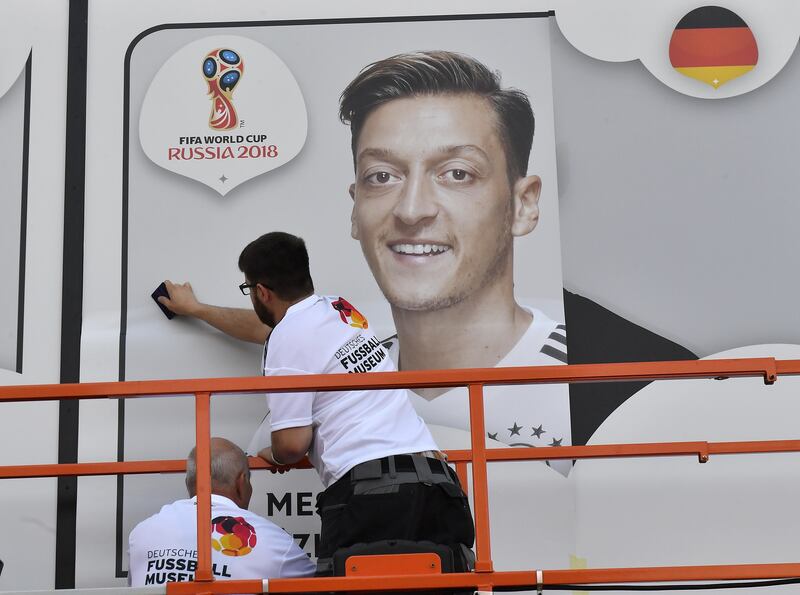 A poster of Mesut Ozil is put up before the 2018 World Cup