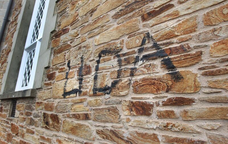 Paramilitary graffiti daubed on Catholic church – The Irish News