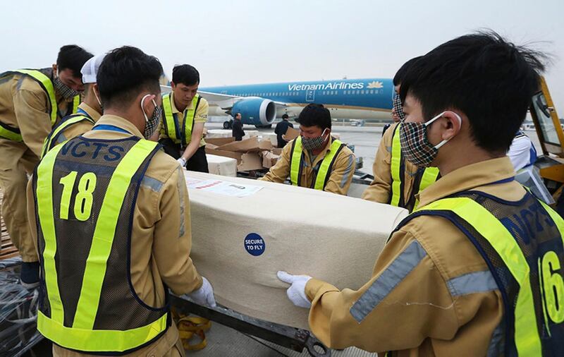 Airport personnel load a coffin into an ambulance at the Noi Bai airport on Wednesday, November 27, 2019, in Hanoi, Vietnam. Picture by VnExpress via Associated Press