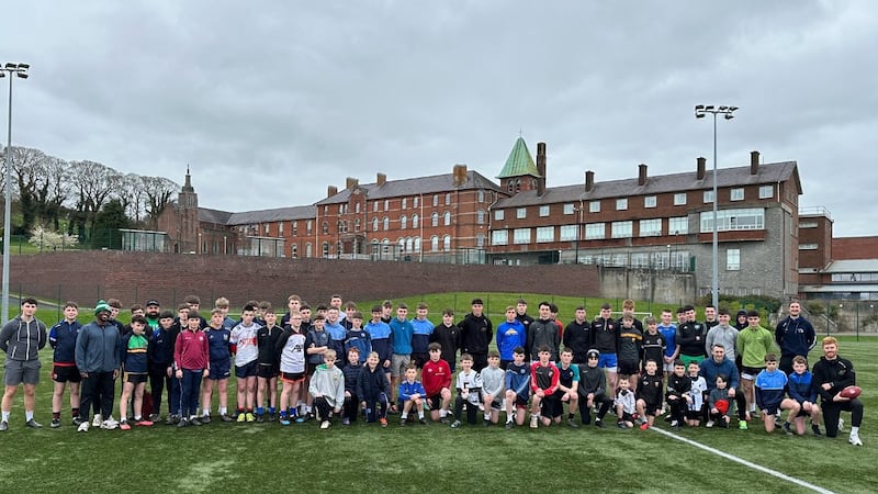 New Orleans Saints star Charlie Smyth and Leader Kicking coaches with a group of young hopefuls at St Colman's College last week