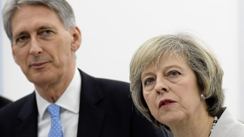 Britain&#39;s prime minister Theresa May and chancellor Philip Hammond tour the Renishaw innovation and engineering plant in Gloucestershire on Wednesday. Picture by Toby Melville, Press Association 