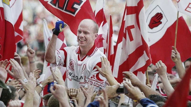 All-Ireland wining captain Peter Canavan is carried across the Croke Park pitch by Tyrone supporters. 