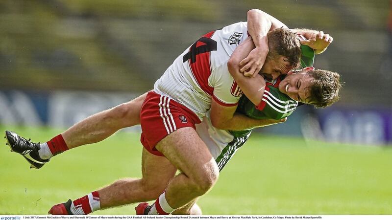 Emmett McGuckin of Derry and Diarmuid O&#39;Connor of Mayo tussle in Castlebar Picture by David Maher/Sportsfile 