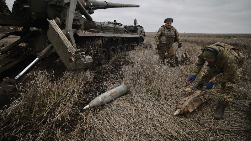 Soldiers prepare a self-propelled artillery vehicle to fire near Bakhmut, Donetsk region, Ukraine, Thursday, Nov. 10, 2022. (AP Photo/Roman Chop)
