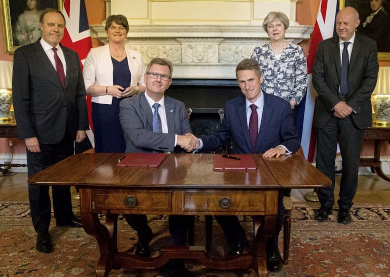 Sir Jeffrey Donalson with colleagues Arlene Foster and Nigel Dodds signing the `confidence and supply deal&#39; that gave the party the balance of power with then prime minister Theresa May. Picture by Daniel Leal-Olivas/PA Wire 