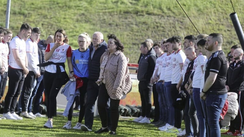Damian Casey&#39;s devastated parents Sean and Susan and daughters Louise and Catherine attend a vigil at Eoghan Ruadh GAA club. Picture by Hugh Russell. 