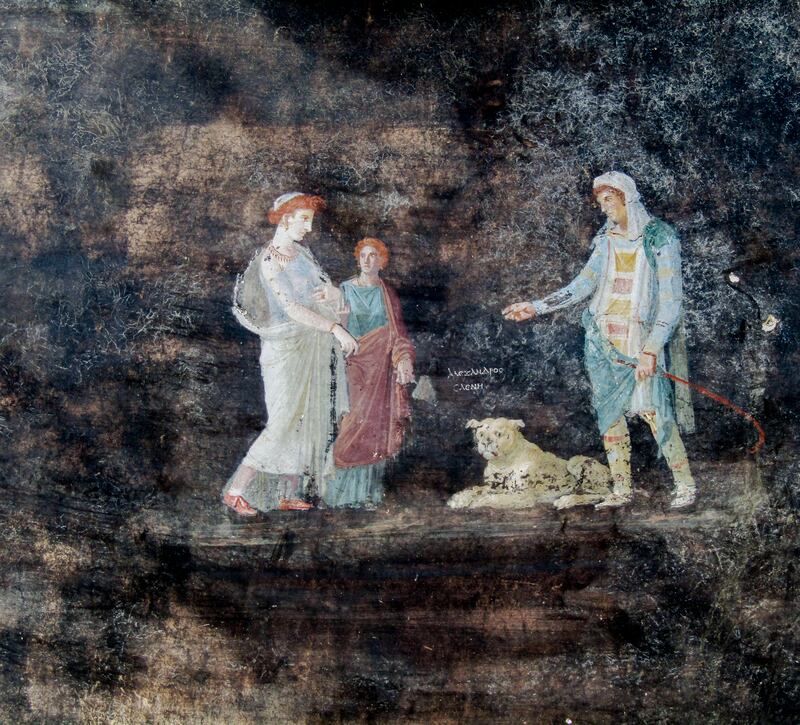 A fresco depicting Greek mythology’s figures of Helen, left, and Paris of Troy, right, inside an imposing banquet hall unearthed in the Pompeii archaeological area near Naples in southern Italy (Italian Culture Ministry/AP)