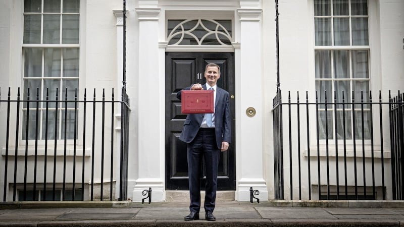 Chancellor of the Exchequer Jeremy Hunt leaves 11 Downing Street, London, with his ministerial box before delivering his Budget at Westminster 