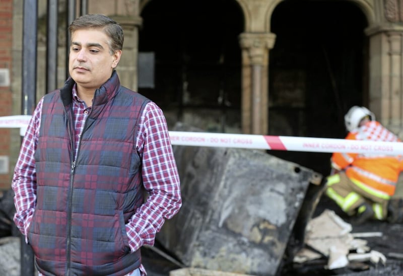 Muhammad Atif, Trustee of the Belfast Multi-Cultural Association, surveys the damage in the wake of another arson attack. Picture Mal McCann. 