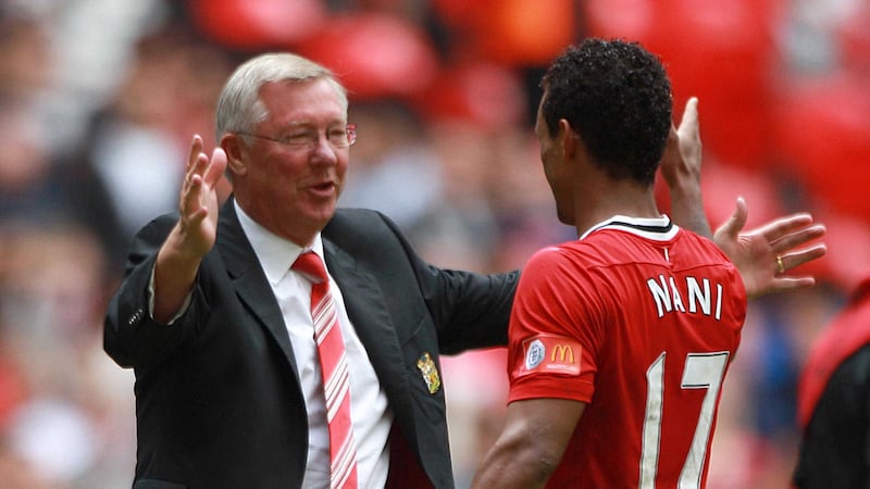 Manchester United manager Alex Ferguson congratulates Luis Nani on their victory after the final whistle during the Community Shield at Wembley Stadium London &nbsp;