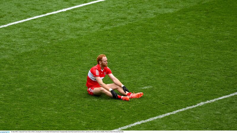 A dejected Conor Glass on the Croke Park turf after Derry's galling defeat by Kerry. Picture: Sportsfile