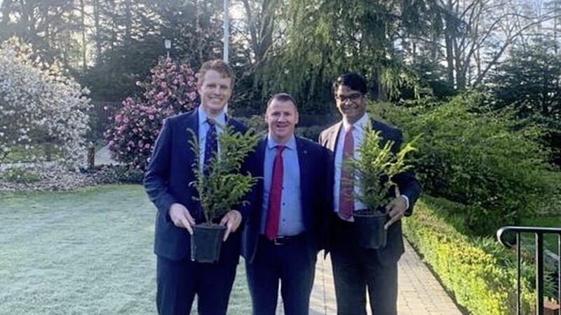 Newry Chamber of Commerce chief executive Tony McKeown presents yew trees to US Consul General Paul Narain (right) and special envoy Joseph Kennedy III 