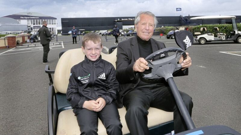 Golf legend Gary Player together with Harry O&#39;Hara (10) heading for the practice ground during The Open at Royal Portrush. Picture by Margaret McLaughlin 