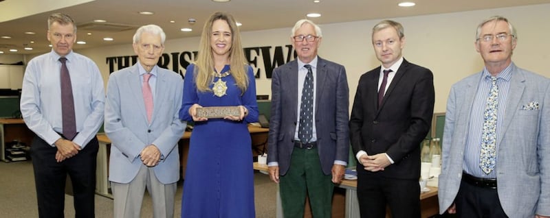 Belfast Lord Mayor Kate Nicholl at The Irish News offices for the handing over of the Belfast Blitz plaque with, from left, Irish News editor Noel Doran, Irish News chairman Jim Fitzpatrick, former Belfast Telegraph editor Ed Curran, current editor-in-chief Eoin Brannigan and historian Dr &Eacute;amon Phoenix. Picture by Hugh Russell