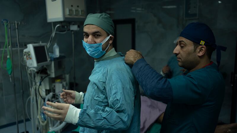 Dr. Suhaib Alhamss gets ready to perform surgery