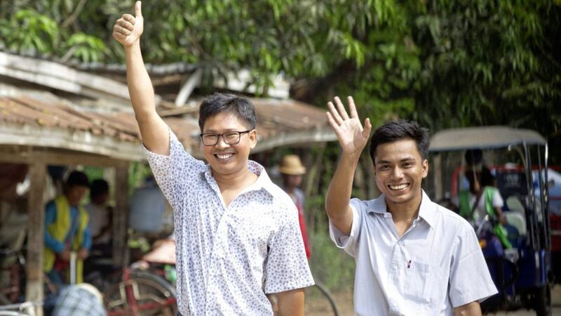Reuters journalists Wa Lone, left, and Kyaw She Oo wave as they walk out from Insein Prison after being released in Yangon, Myanmar Picture by Thein Zaw/AP 