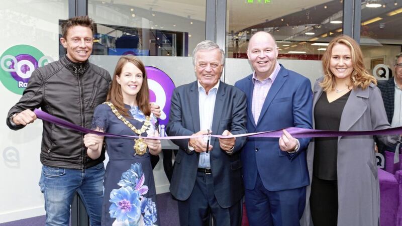 Pictured officially launching Q Radio&rsquo;s new headquarters &lsquo;QHQ&rsquo; are presenters of Northern Ireland&rsquo;s Best Breakfast Show Stephen Clements and Cate Conway with the Lord Mayor of Belfast councillor Nuala McAllister, radio broadcaster Tony Blackburn, cutting the ribbon, and Managing Director and Head of Programmes at Q Radio, Robert Walshe.   