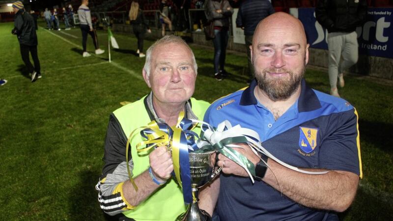 St Paul&#39;s, Holywood management Paddy Hannigan (left) and Peadar Heffron with the trophy after guiding their team to Down Junior Football final victory over Aughlisnafin at Pairc Esler, Newry on Friday September 18 2020. Picture courtesy of Steven Kane 