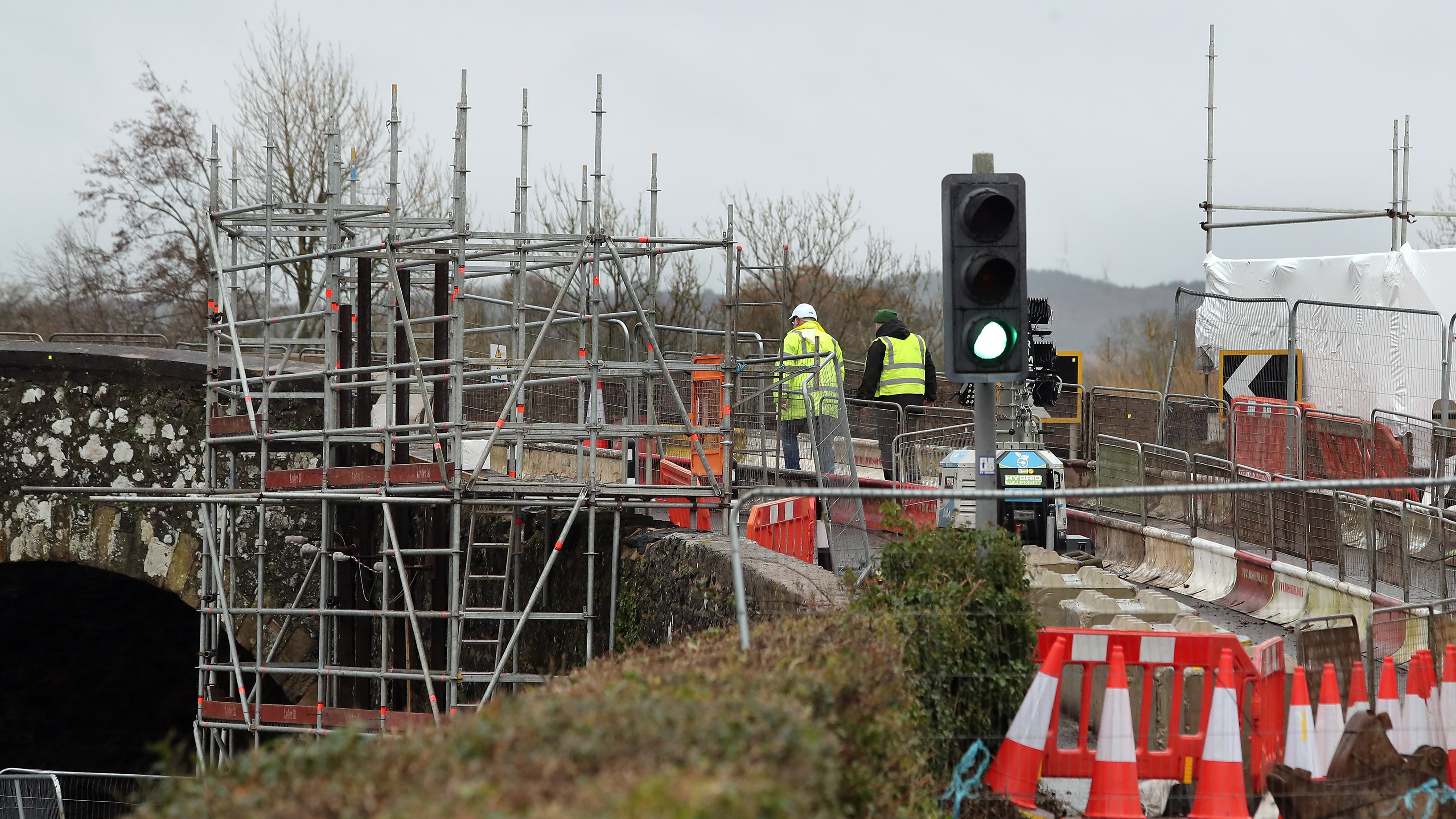 Workers at Kilrea bridge on Friday ahead of it's partial reopening on Saturday morning PICTURE: MARGARET MCLAUGHLIN