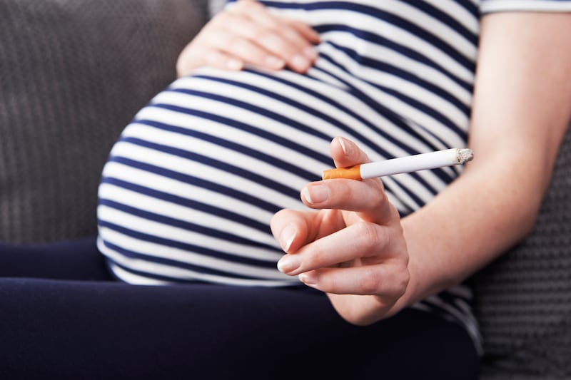 Pregnant woman smoking.