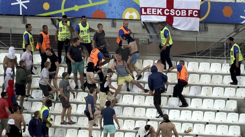Supporters and stewards clash in the stands after the Euro 2016 Group B soccer match between England and Russia at the Velodrome stadium in Marseille on Saturday. Picture by Ariel Schalit, Associated Press