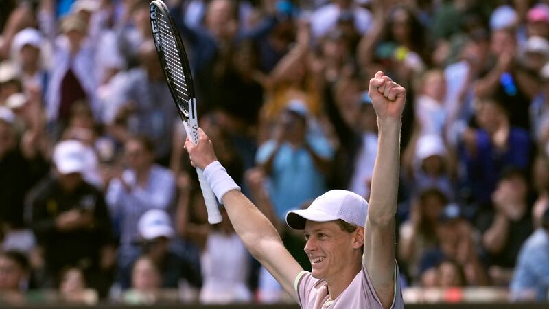 Jannik Sinner of Italy celebrates after defeating Novak Djokovic of Serbia in their semifinal at the Australian Open tennis championships at Melbourne Park, Melbourne, Australia, Friday, Jan. 26, 2024. (AP Photo/Andy Wong)