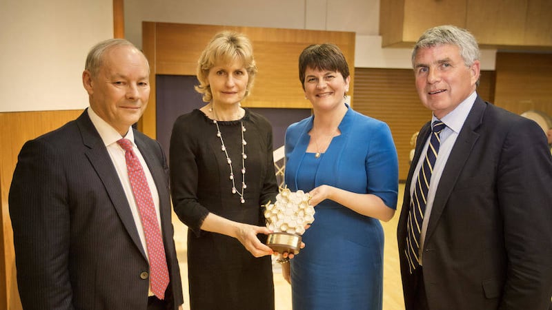 Lady Mary Ballyedmond receives the innovation award, watched by Peter Fitzgerald, Arlene Foster and Richard Milliken 
