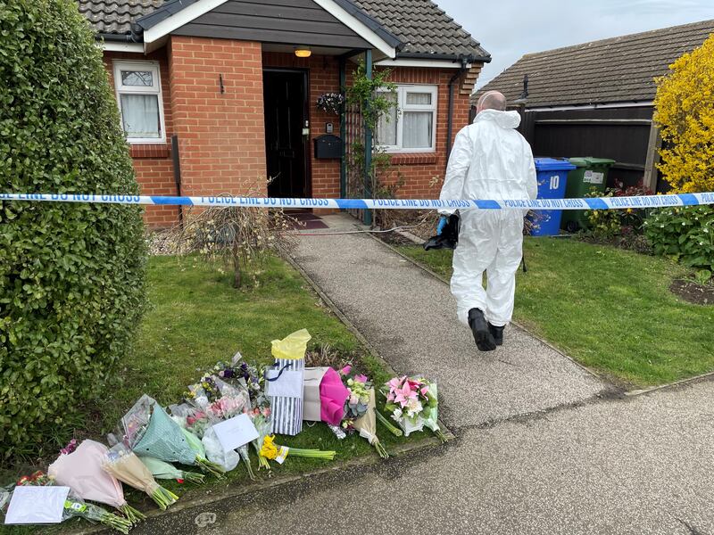 A forensics officer at a property in Pakefield, Suffolk, where 82-year-old Joy Middleditch was found.
