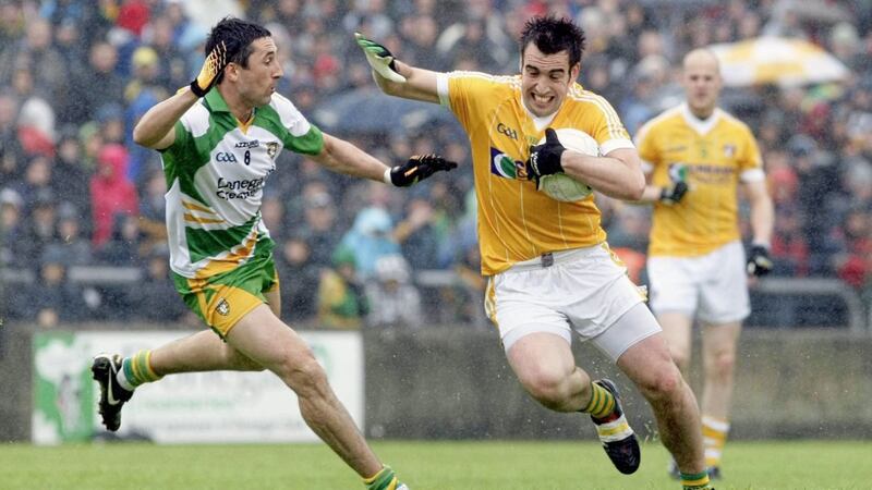 Kevin Niblock (right), pictured against Donegal&#39;s Rory Kavanagh in 2011, may have kicked his last ball for Antrim 