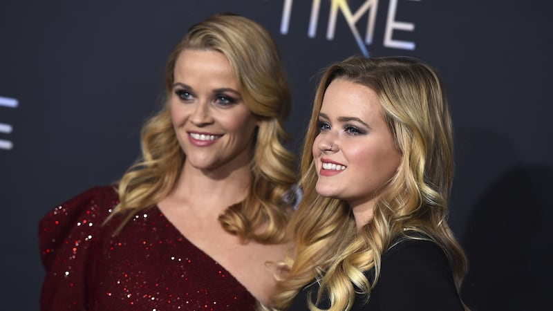 Witherspoon sparkled in a red asymmetric sequinned dress.